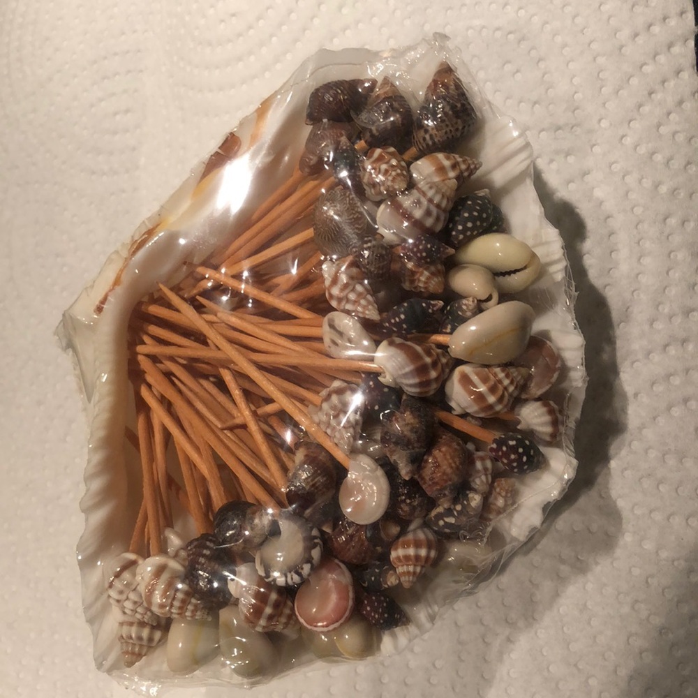 New unopened Sealed in original packaging. Seashell appetizer sticks & shell.